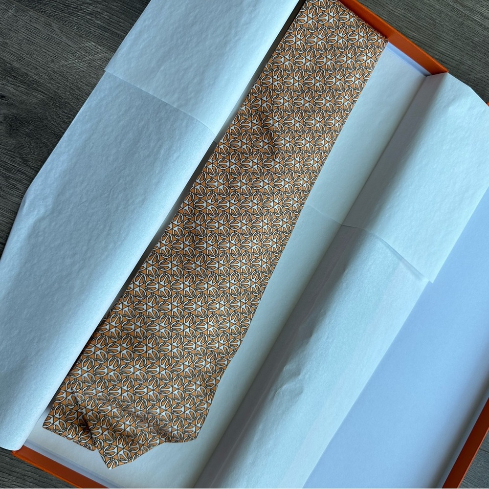 Hermès 100% Silk Orange Medallion Repeating Pattern Tie